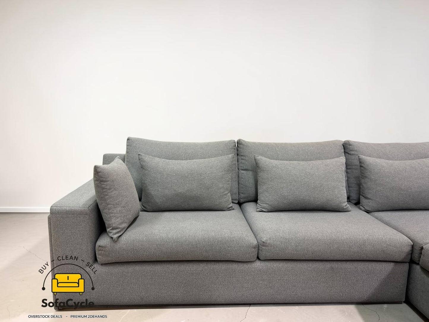 Hoekzetel grijs in stof met extra kussens – tweedehands